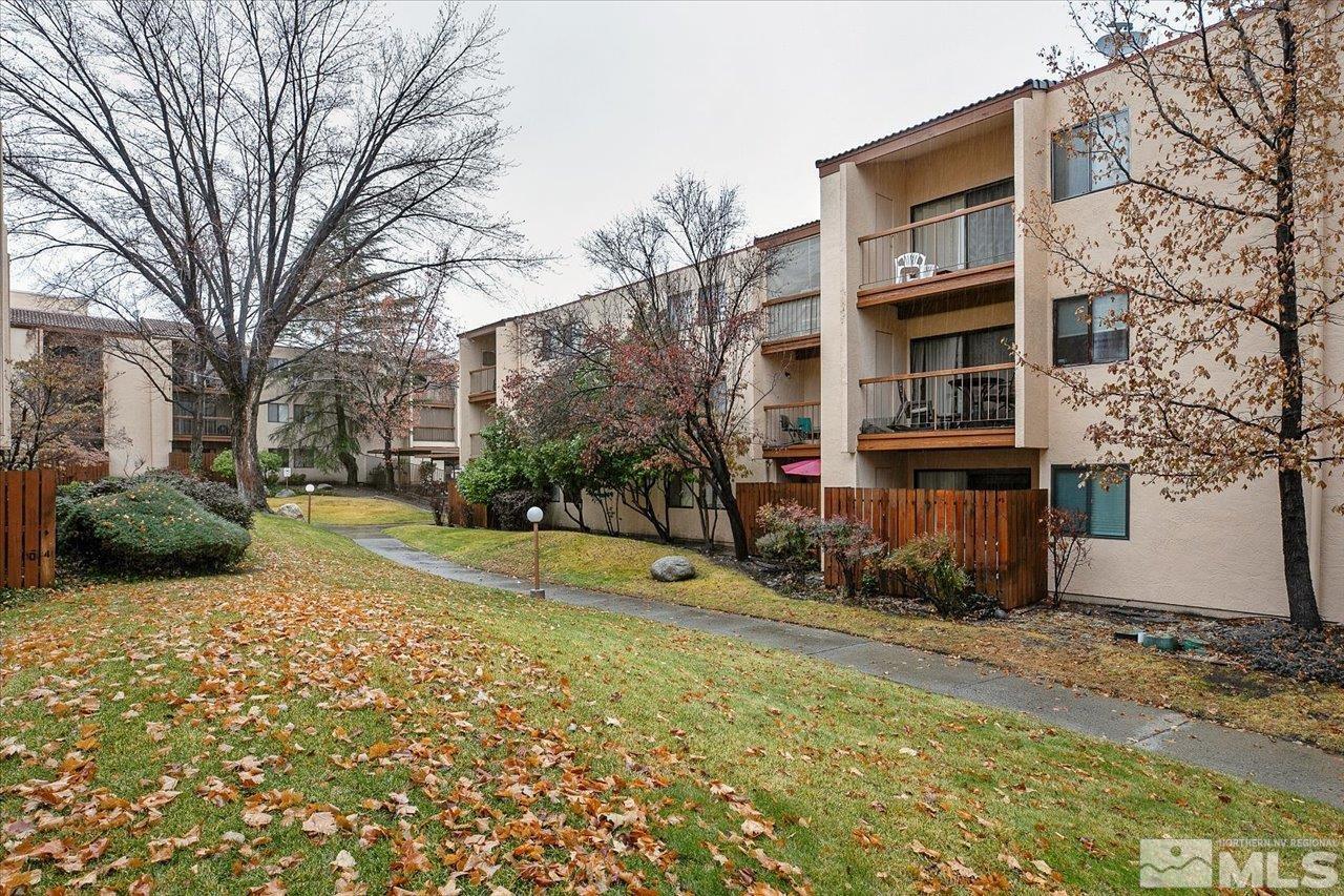 2750 Plumas Street, Unit 219 Reno, NV 89509 - Photo 20 of 22 a view of a house with a yard and large trees