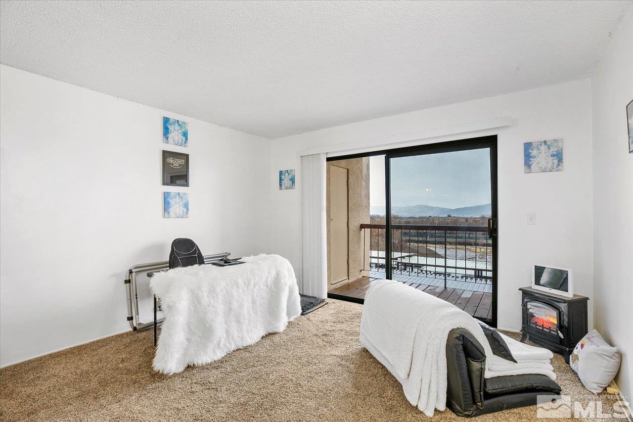 2750 Plumas Street, Unit 219 Reno, NV 89509 - Photo 4 of 22 a living room with furniture and a flat screen tv