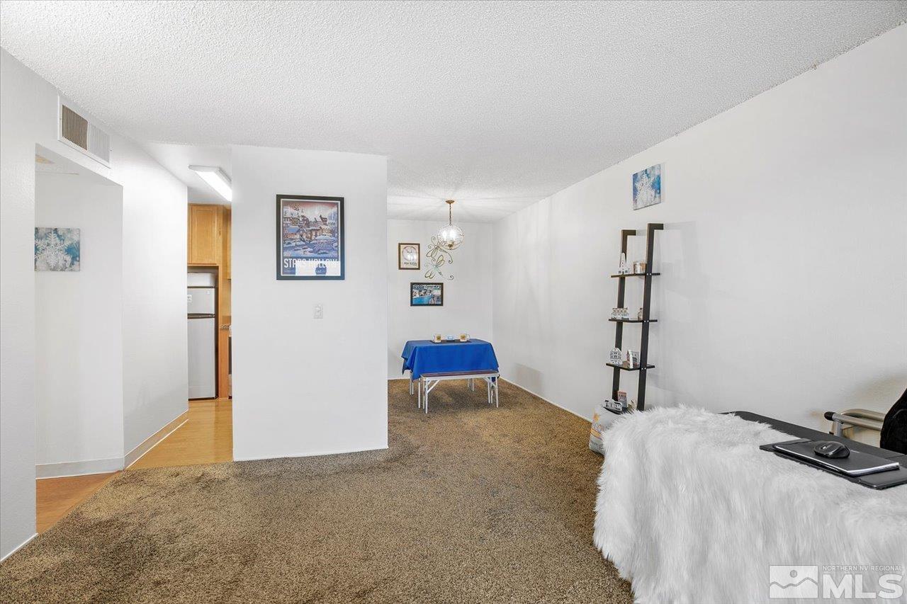 2750 Plumas Street, Unit 219 Reno, NV 89509 - Photo 6 of 22 a bedroom with a bed and a cabinets