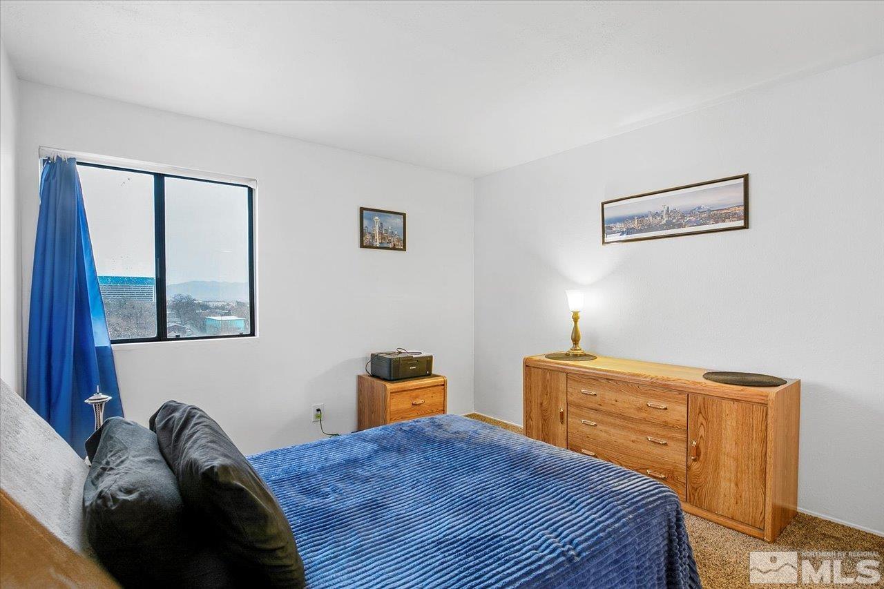 2750 Plumas Street, Unit 219 Reno, NV 89509 - Photo 10 of 22 a bedroom with a bed and window