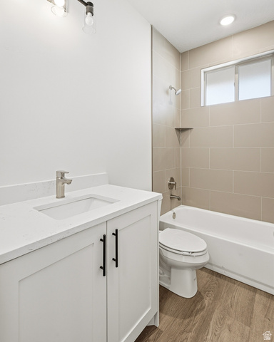 4978 North 75 East Enoch, UT 84721 - Photo 30 of 60 Bathroom featuring vanity, dark wood finished floors, and shower / bath combination