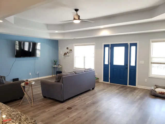a living room with furniture and a flat screen tv