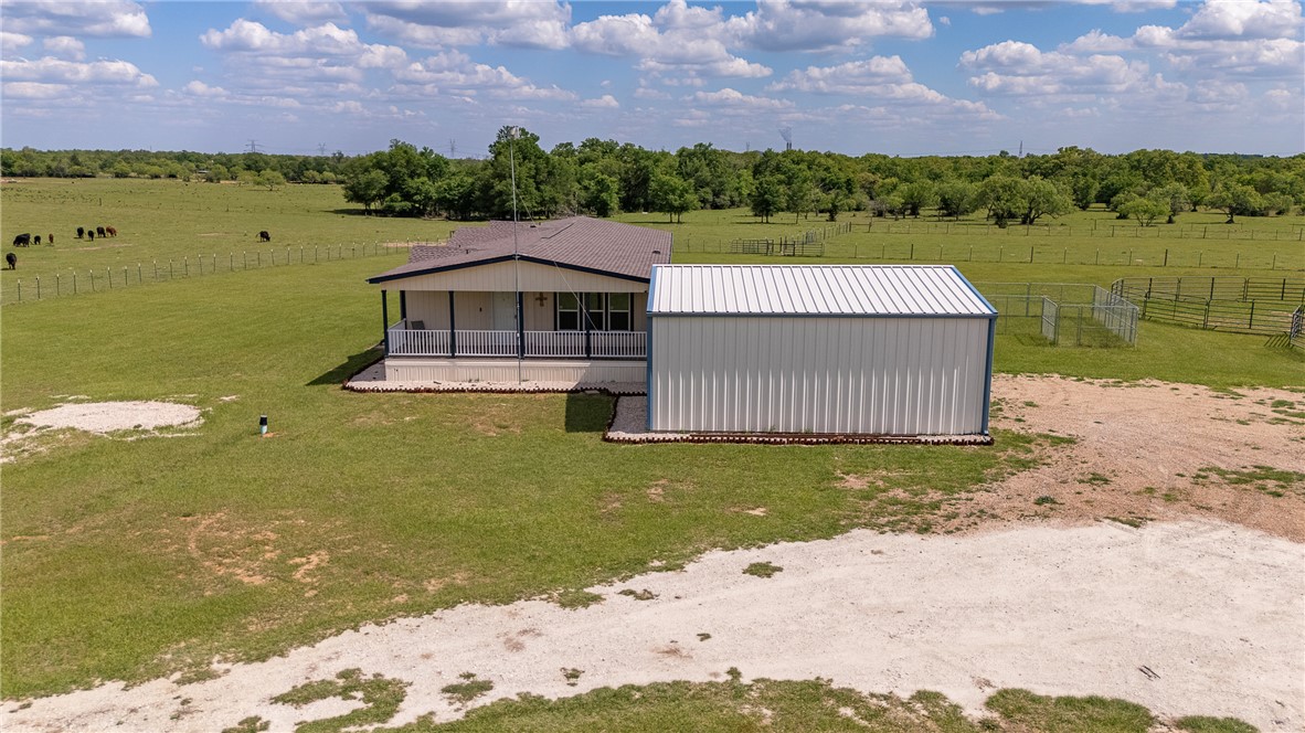 10976 Whiterock Road Bremond, TX 76629 - Photo 5 of 42 a view of a lake with a house in the background