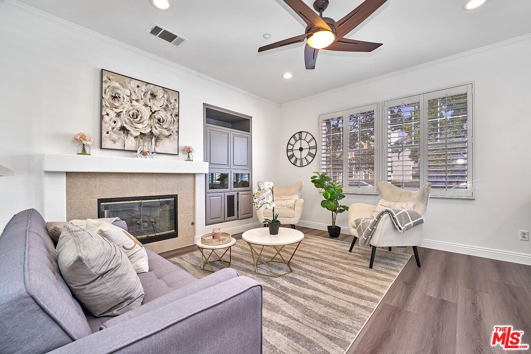38 Windward Way Buena Park, CA 90621 - Photo 11 of 71 a living room with furniture and a fireplace