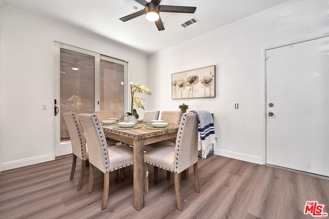 38 Windward Way Buena Park, CA 90621 - Photo 18 of 71 a view of a dining room with furniture and wooden floor