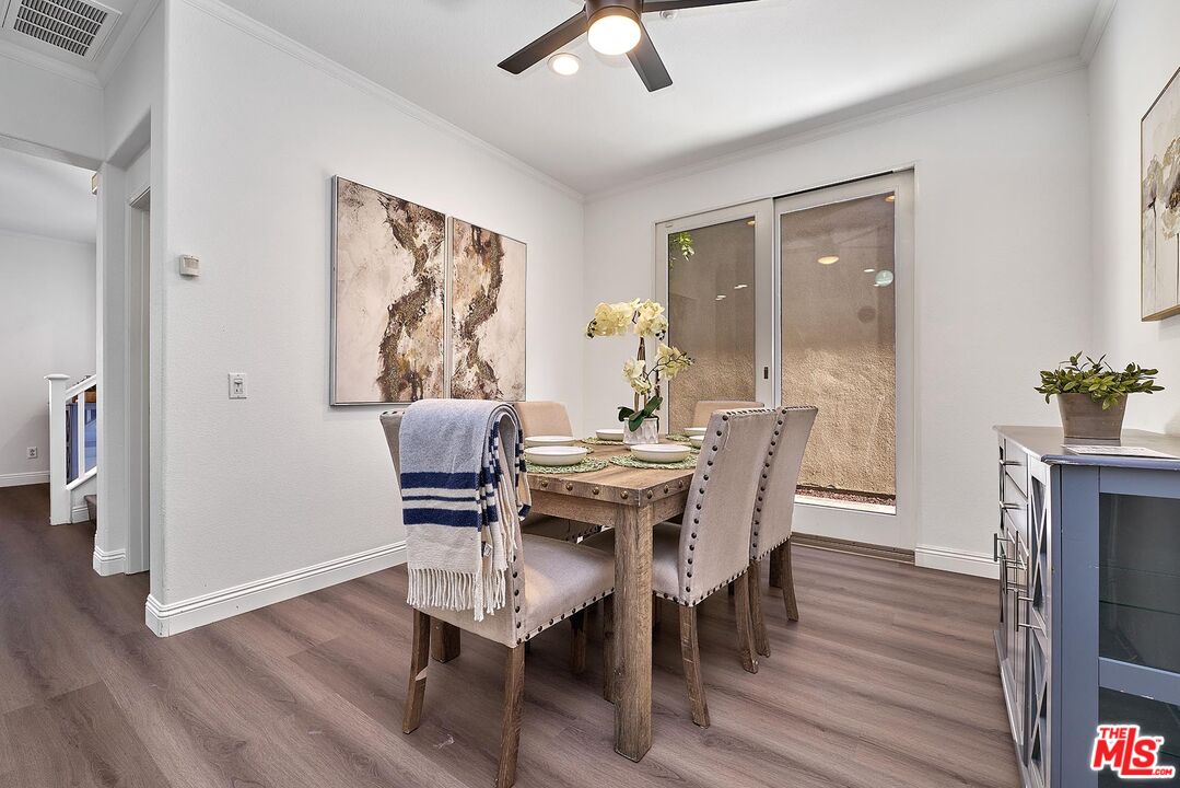 38 Windward Way Buena Park, CA 90621 - Photo 19 of 71 a view of a dining room with furniture window and wooden floor