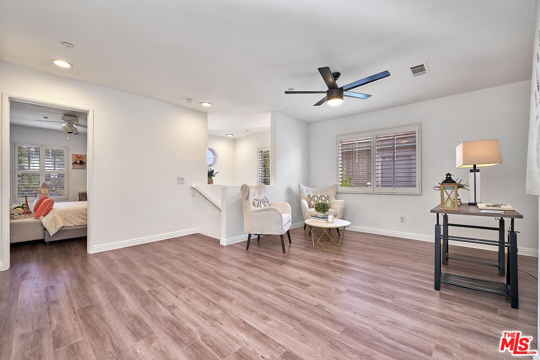 38 Windward Way Buena Park, CA 90621 - Photo 27 of 71 a living room with furniture and a wooden floor