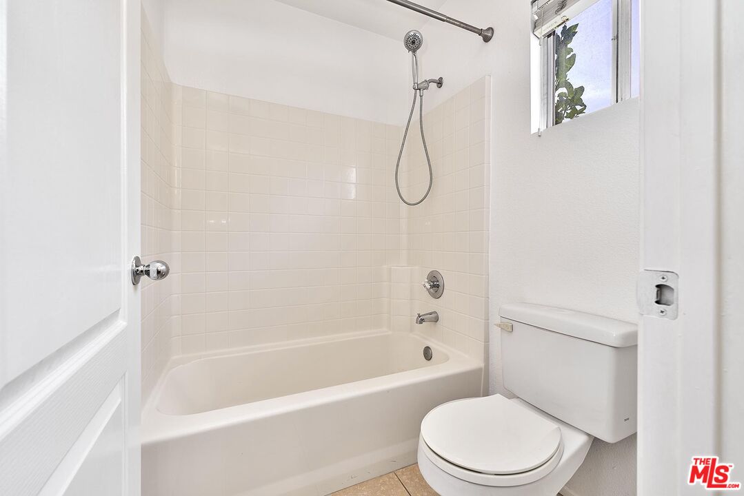38 Windward Way Buena Park, CA 90621 - Photo 35 of 71 a white toilet sitting next to a bath tub