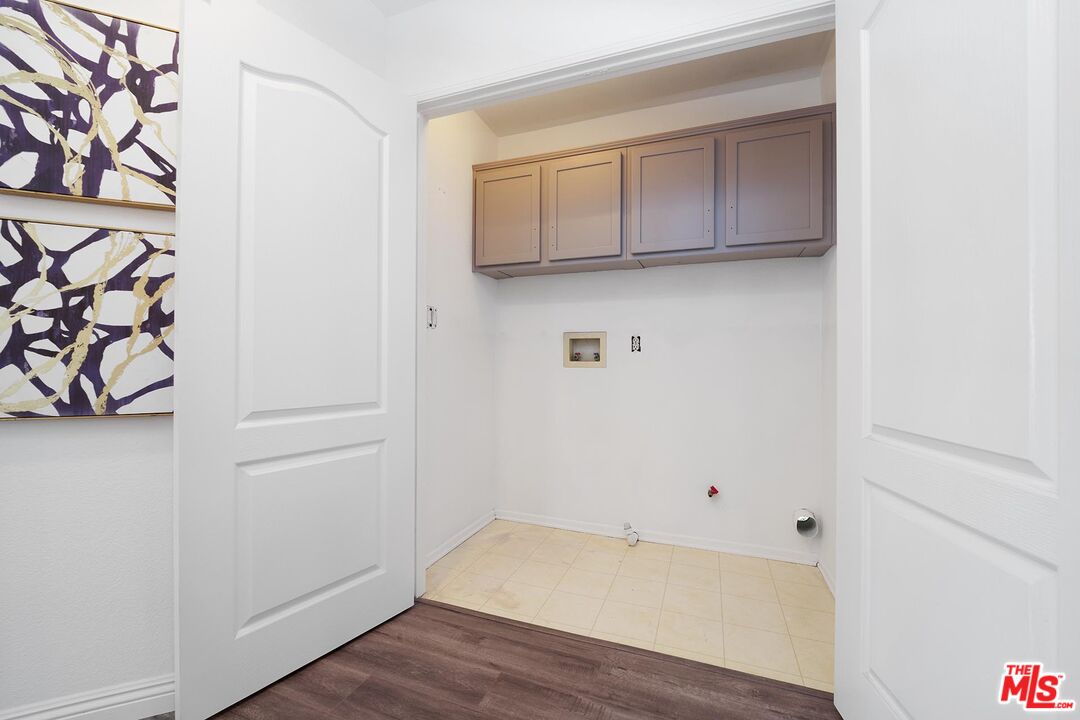 38 Windward Way Buena Park, CA 90621 - Photo 38 of 71 a view of a storage and utility room with wooden floor