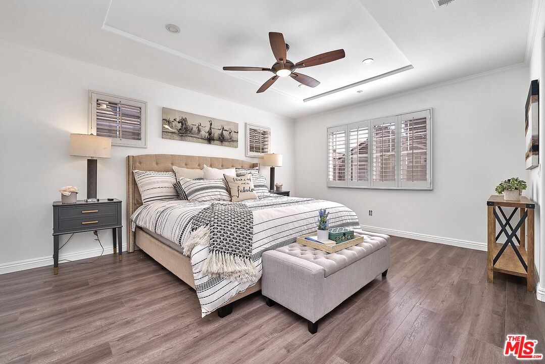 38 Windward Way Buena Park, CA 90621 - Photo 39 of 71 a bedroom with a bed and wooden floor