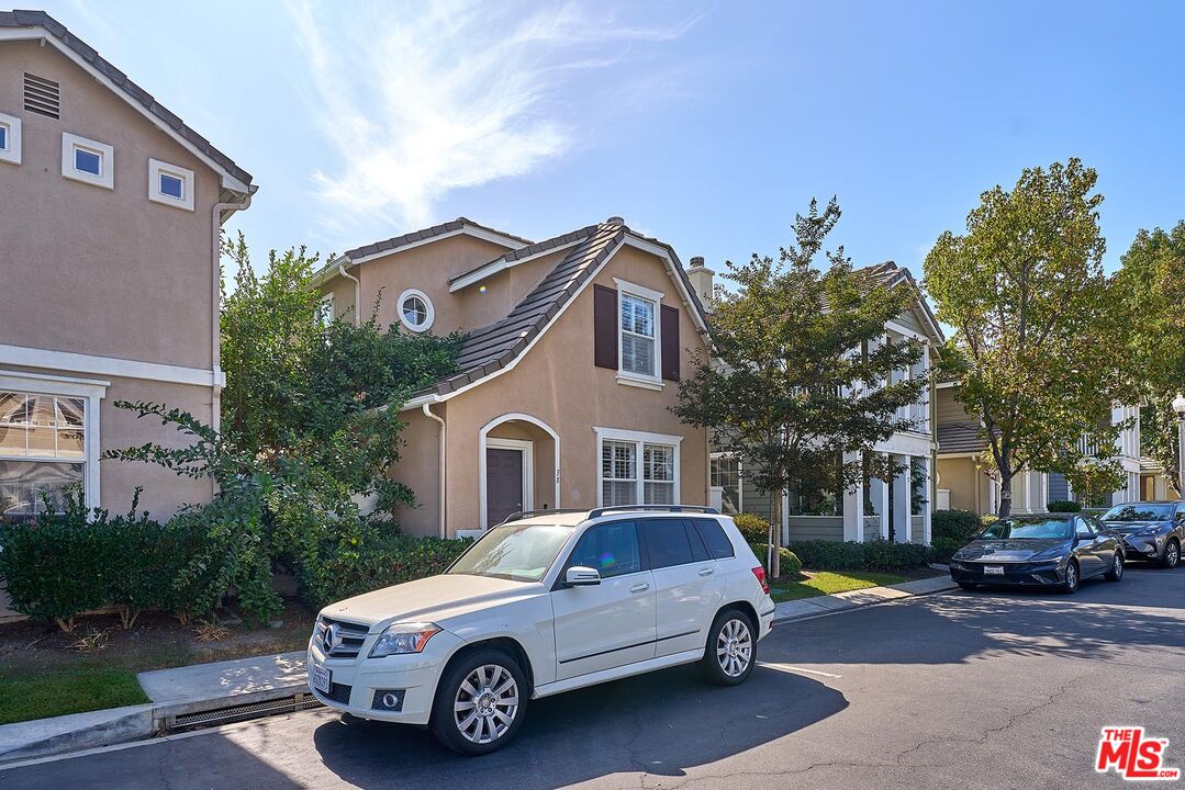 38 Windward Way Buena Park, CA 90621 - Photo 51 of 71 a car parked in front of a white house