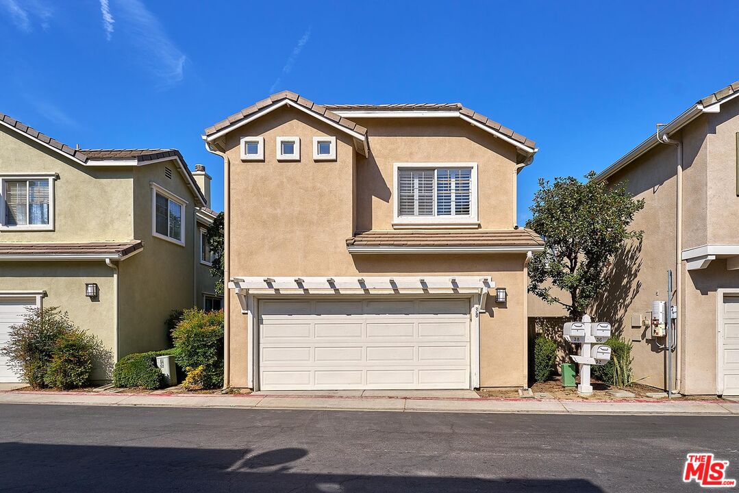 38 Windward Way Buena Park, CA 90621 - Photo 52 of 71 a view of a house with a yard and garage