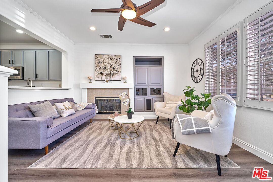 38 Windward Way Buena Park, CA 90621 - Photo 6 of 71 a living room with furniture and a fireplace