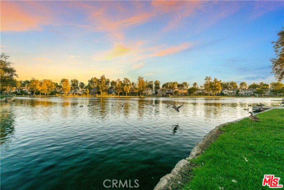 38 Windward Way Buena Park, CA 90621 - Photo 61 of 71 a view of a lake with houses in the back