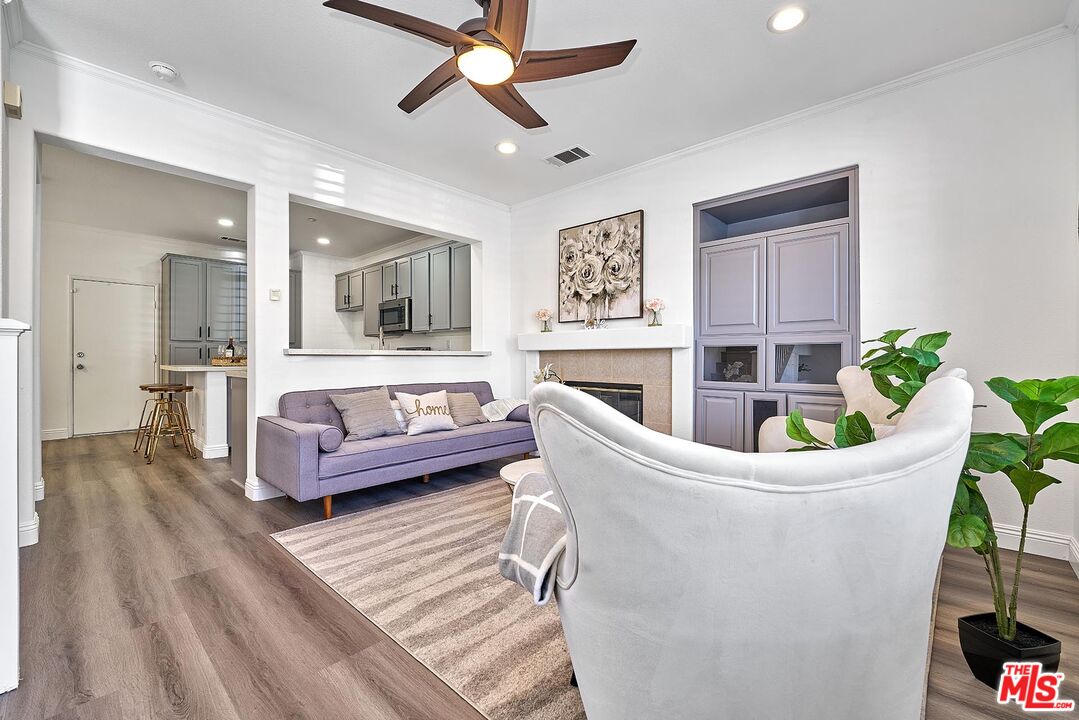 38 Windward Way Buena Park, CA 90621 - Photo 7 of 71 a living room with furniture and a potted plant