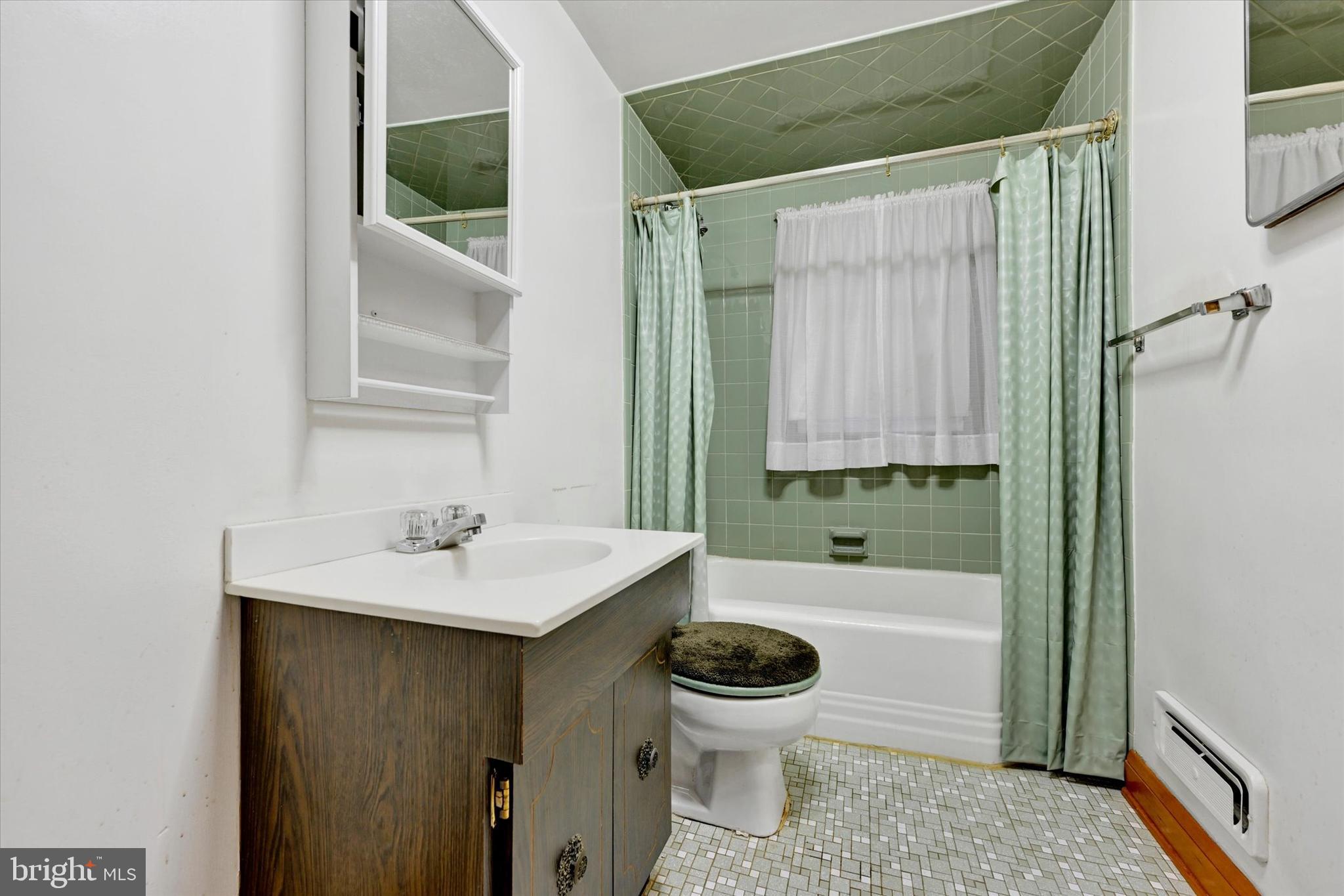 7437 New Cut Road Kingsville, MD 21087 - Photo 14 of 56 a bathroom with a sink a toilet and shower