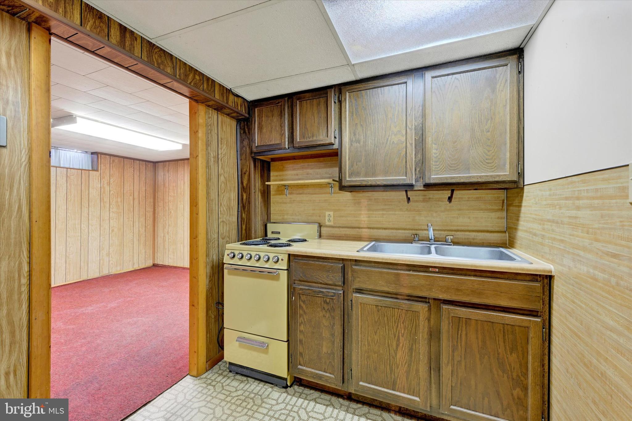 7437 New Cut Road Kingsville, MD 21087 - Photo 20 of 56 a kitchen with a sink cabinets and wooden floor