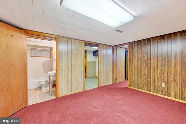 a view of empty room with a bathroom