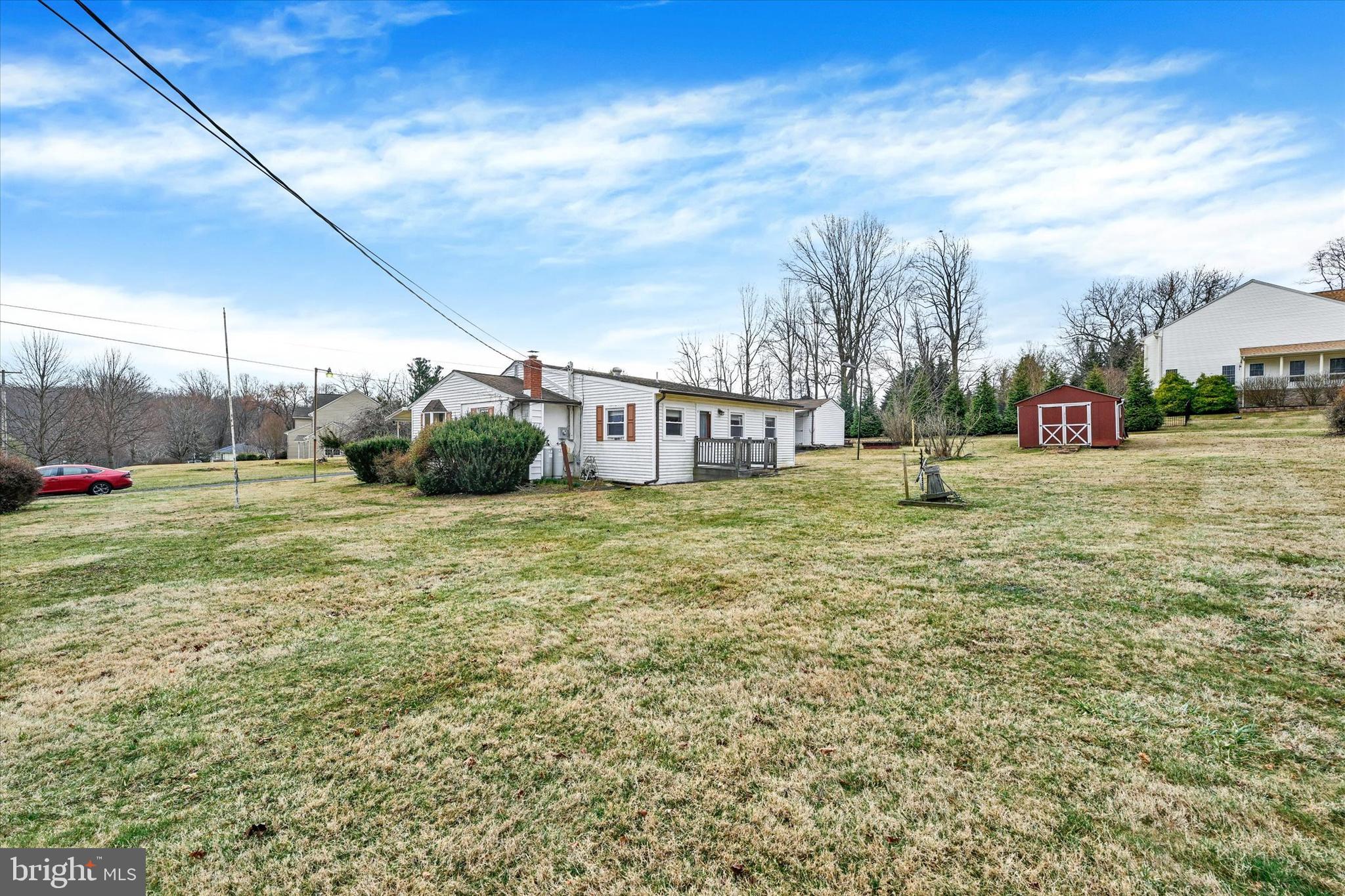 7437 New Cut Road Kingsville, MD 21087 - Photo 29 of 56 a view of a fire pit in front of a house