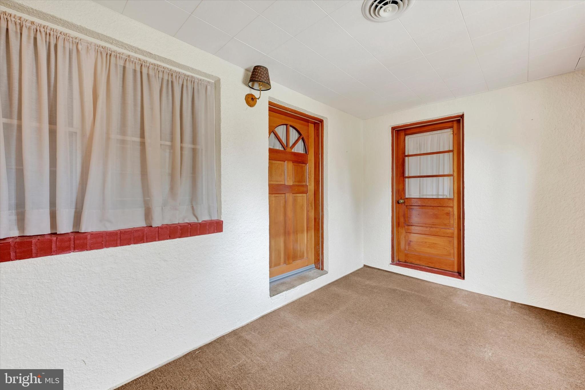 7437 New Cut Road Kingsville, MD 21087 - Photo 4 of 56 a view of an empty room with a window