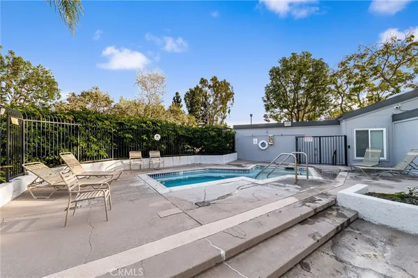 a view of a backyard with sitting area