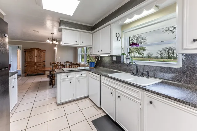 a kitchen with a sink and cabinets