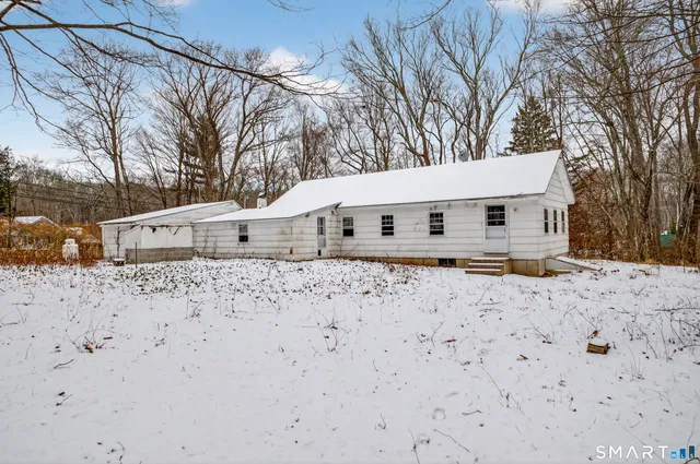 a view of snow on the road