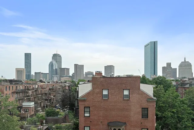 a view of a city with tall buildings in the background