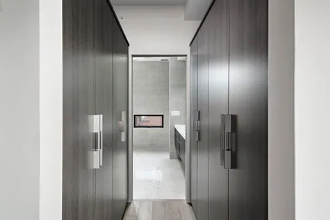 a front view of a building with a garden