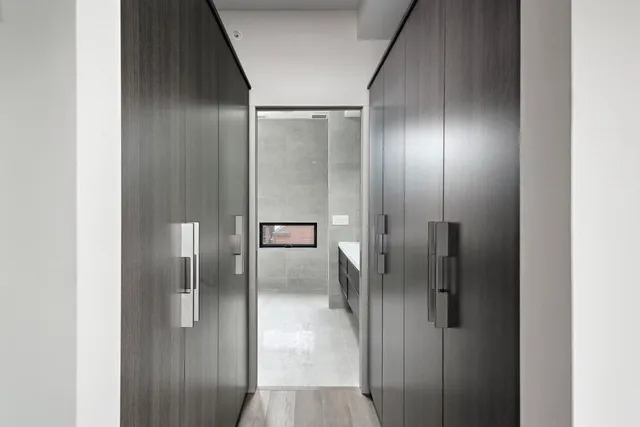 a front view of a building with a garden