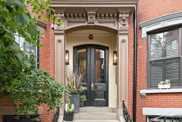 a front view of a building with parking space