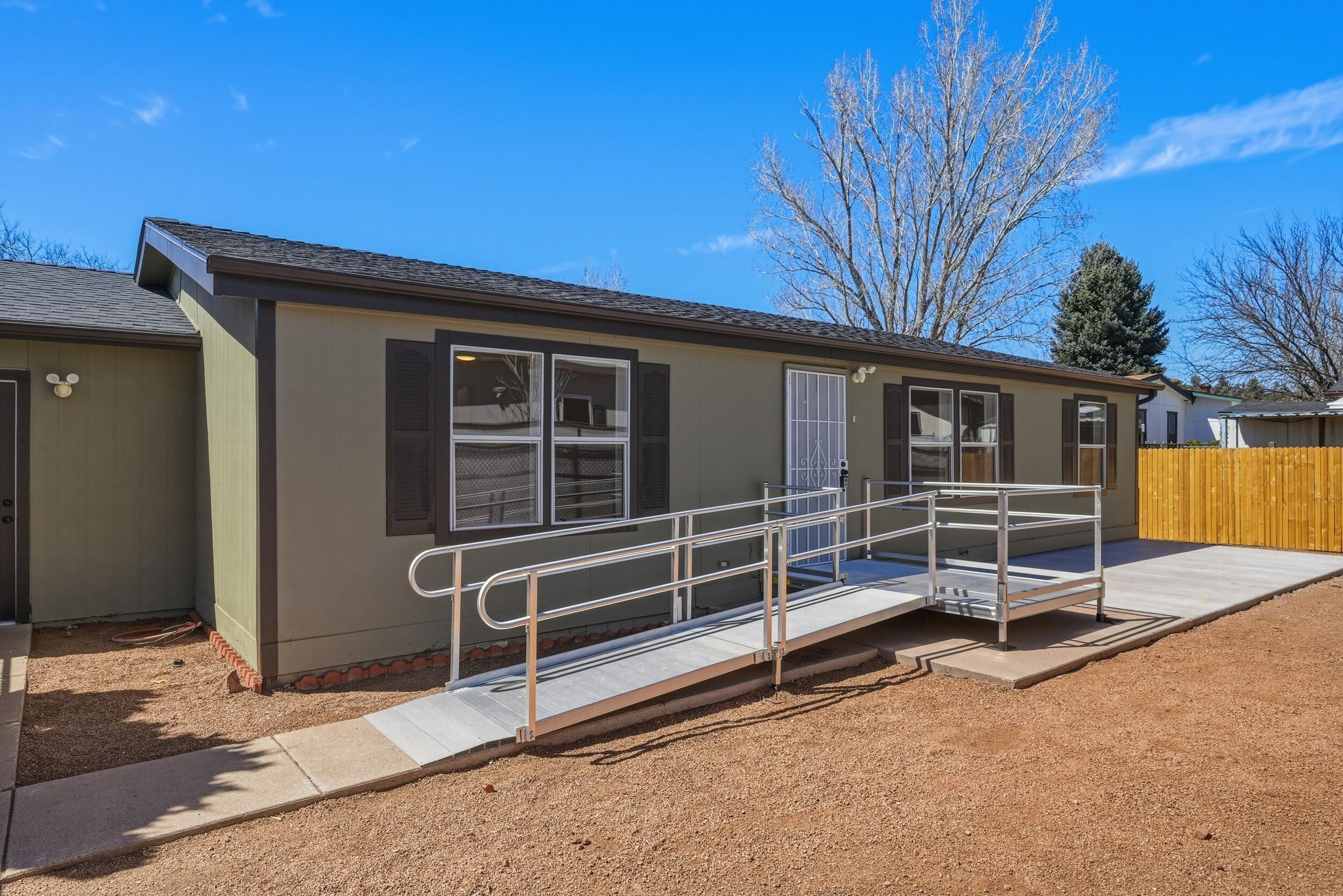 312 East Cedar Milll Road Star Valley, AZ 85541 - Photo 6 of 27 a house with wooden fence and a window