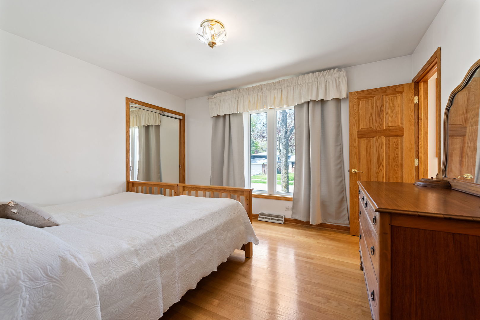 696 Lombardy Lane Deerfield, IL 60015 - Photo 12 of 26 a bedroom with a bed and a window