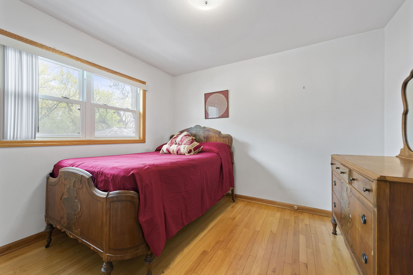696 Lombardy Lane Deerfield, IL 60015 - Photo 16 of 26 a bedroom with a bed and wooden floor
