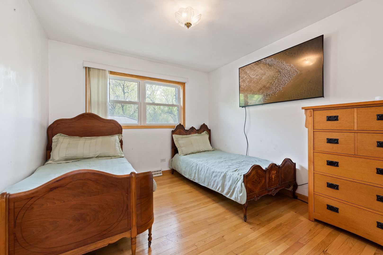 696 Lombardy Lane Deerfield, IL 60015 - Photo 17 of 26 a bedroom with a bed and a window