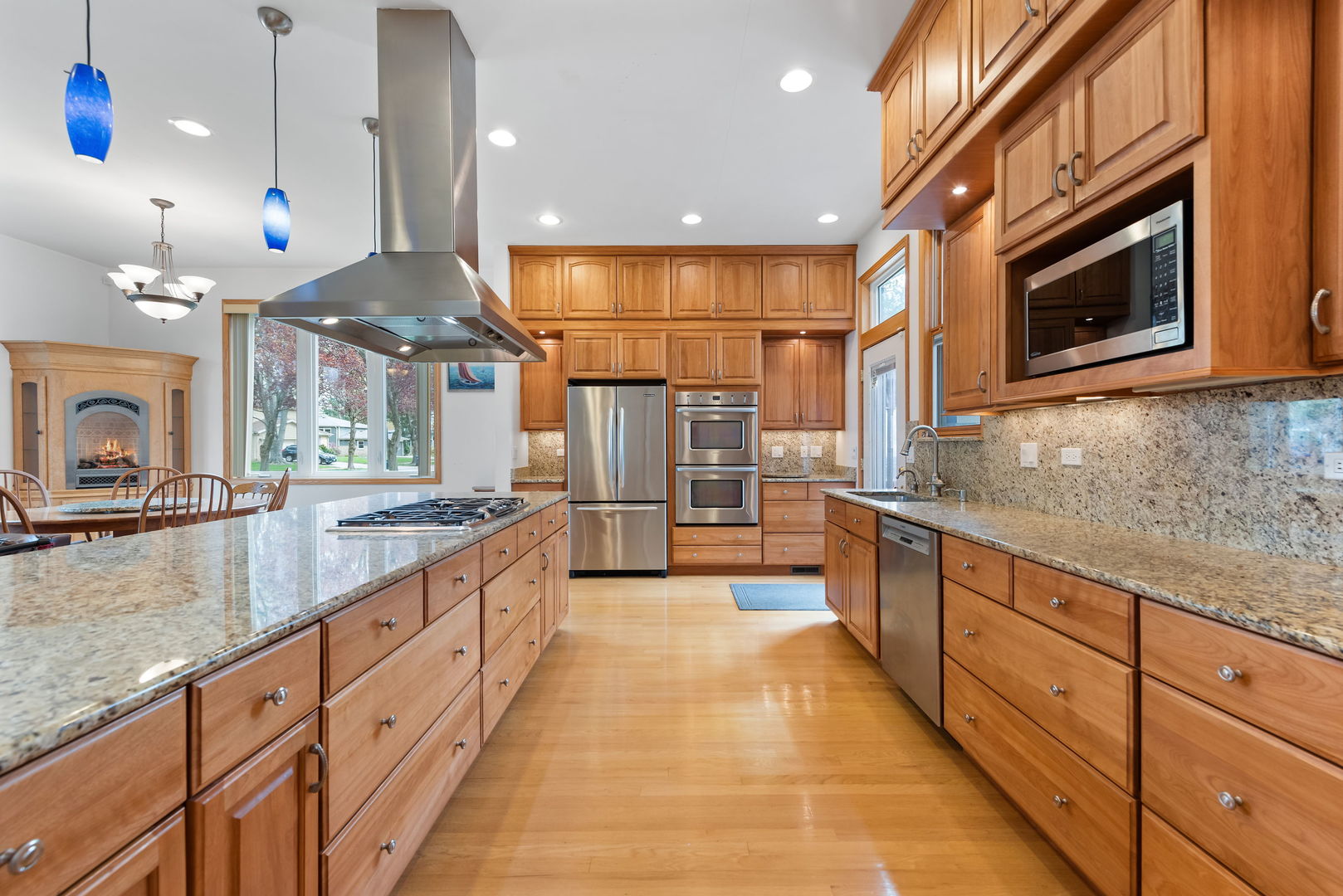 696 Lombardy Lane Deerfield, IL 60015 - Photo 5 of 26 a large kitchen with stainless steel appliances kitchen island granite countertop a large counter top