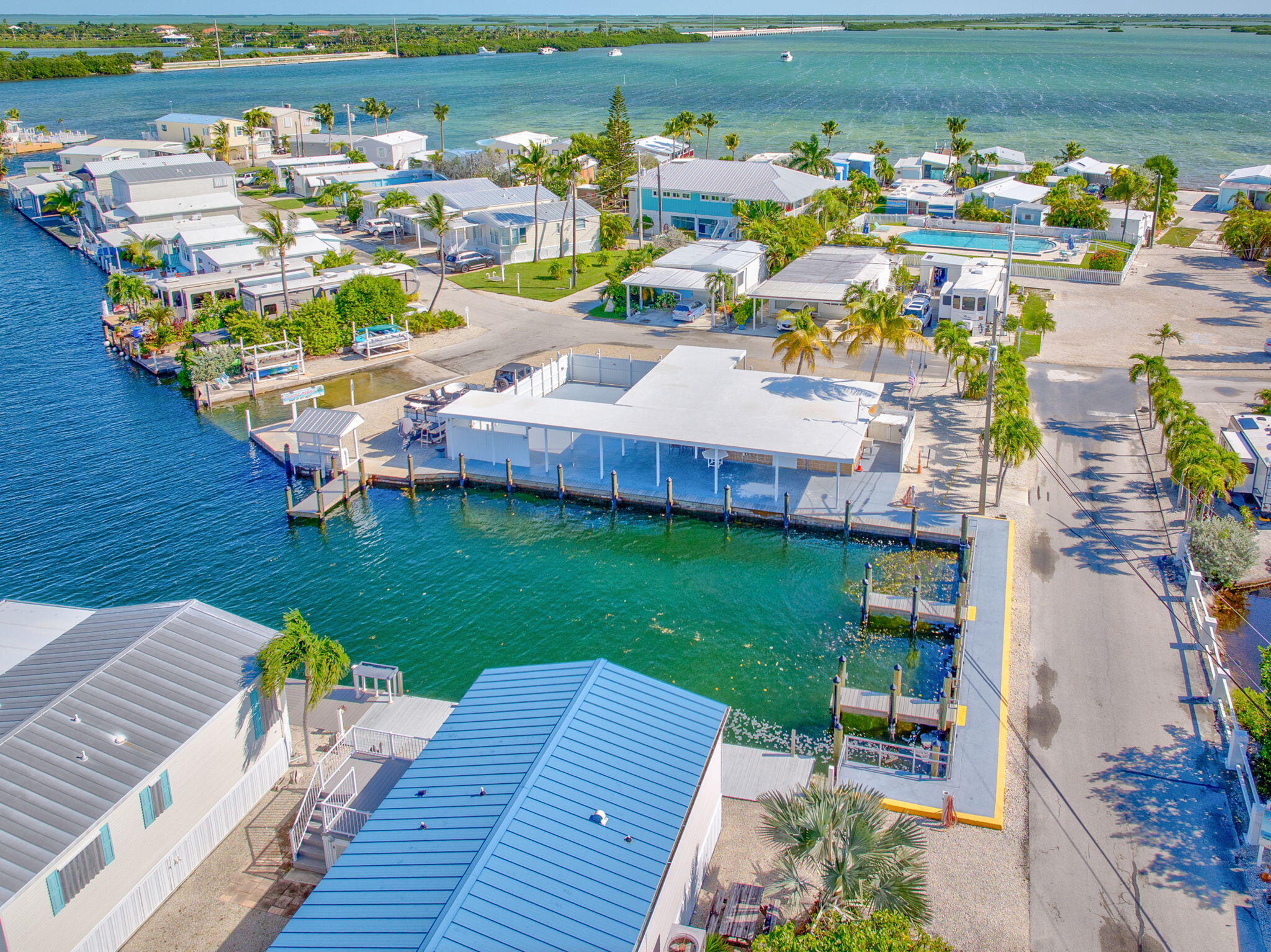 55 Boca Chica Road, Unit 53 Key West, FL 33040 - Photo 24 of 35 a view of a house with a swimming pool patio and outdoor seating