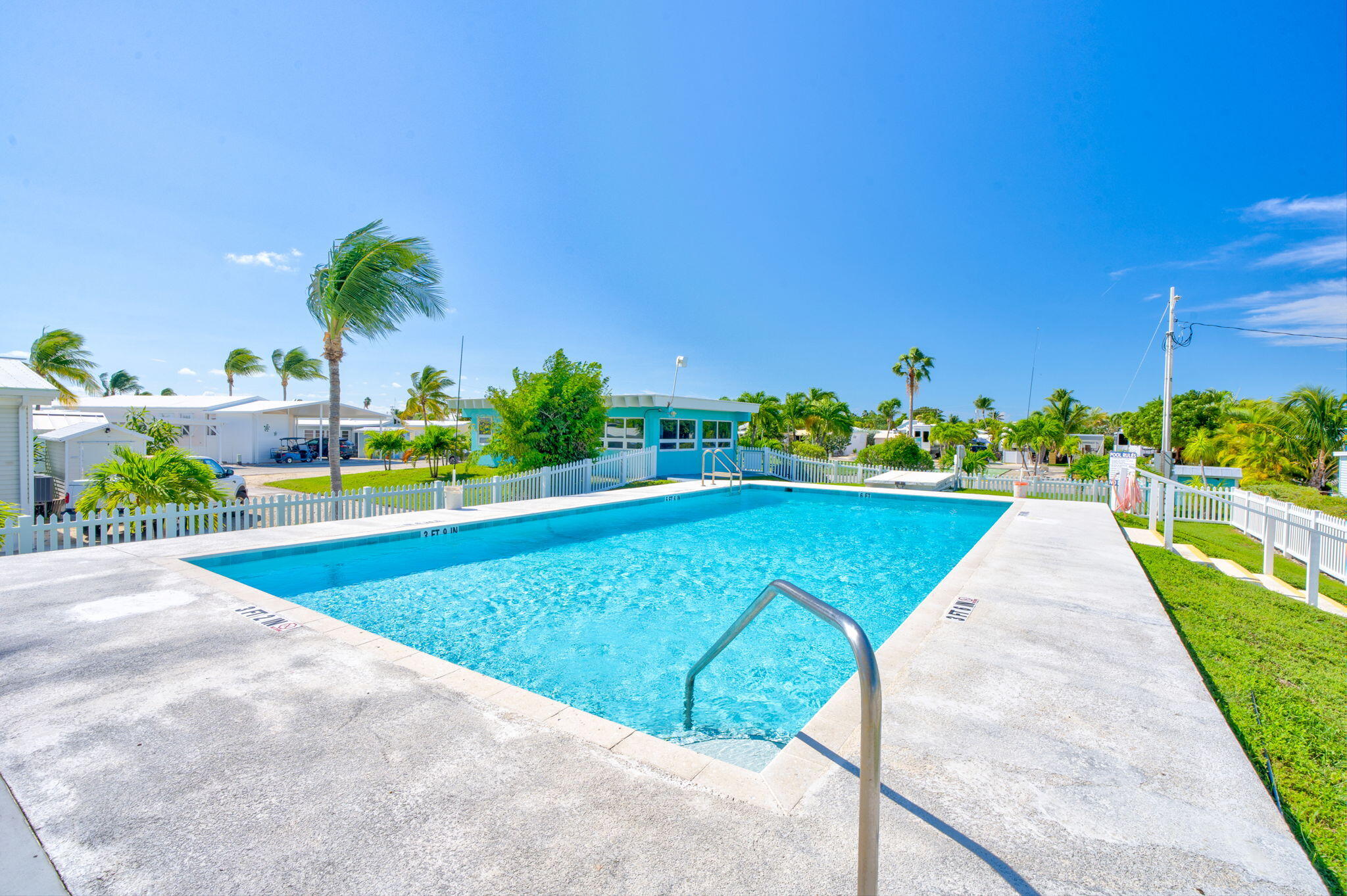 55 Boca Chica Road, Unit 53 Key West, FL 33040 - Photo 30 of 35 a view of a swimming pool with a patio