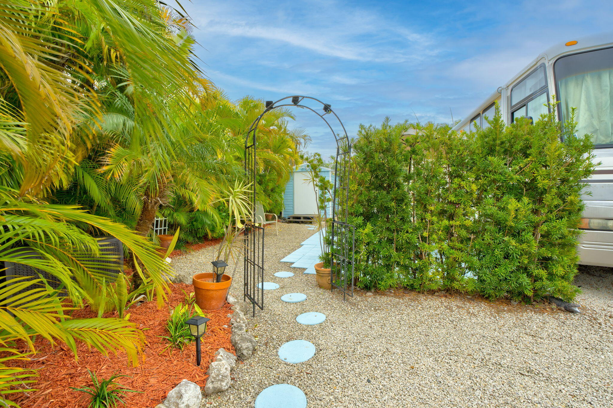 55 Boca Chica Road, Unit 53 Key West, FL 33040 - Photo 3 of 35 a backyard of a house with lots of green space