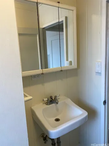 a bathroom with a sink and mirror