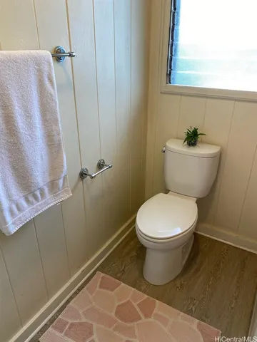 a bathroom with a toilet and a sink