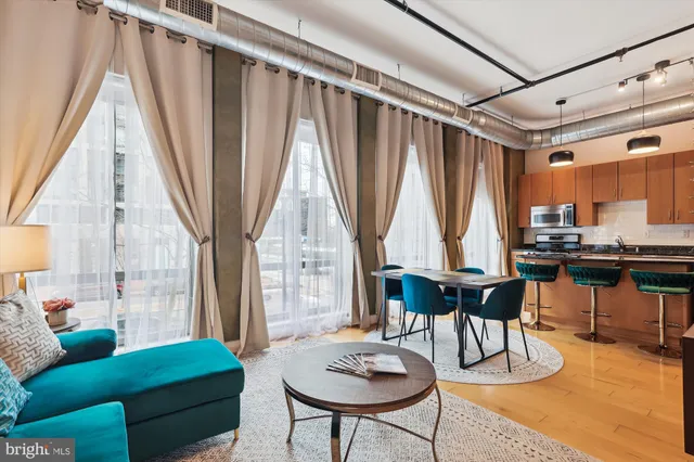 a living room with furniture and a large window