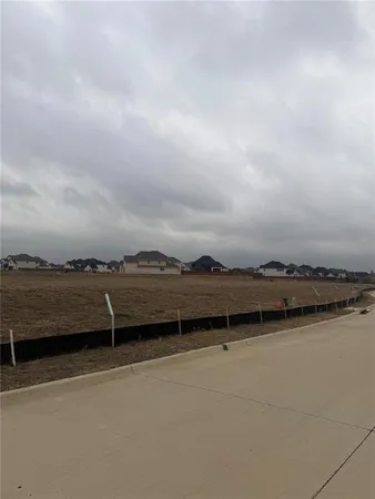 an aerial view of a house with a lake view