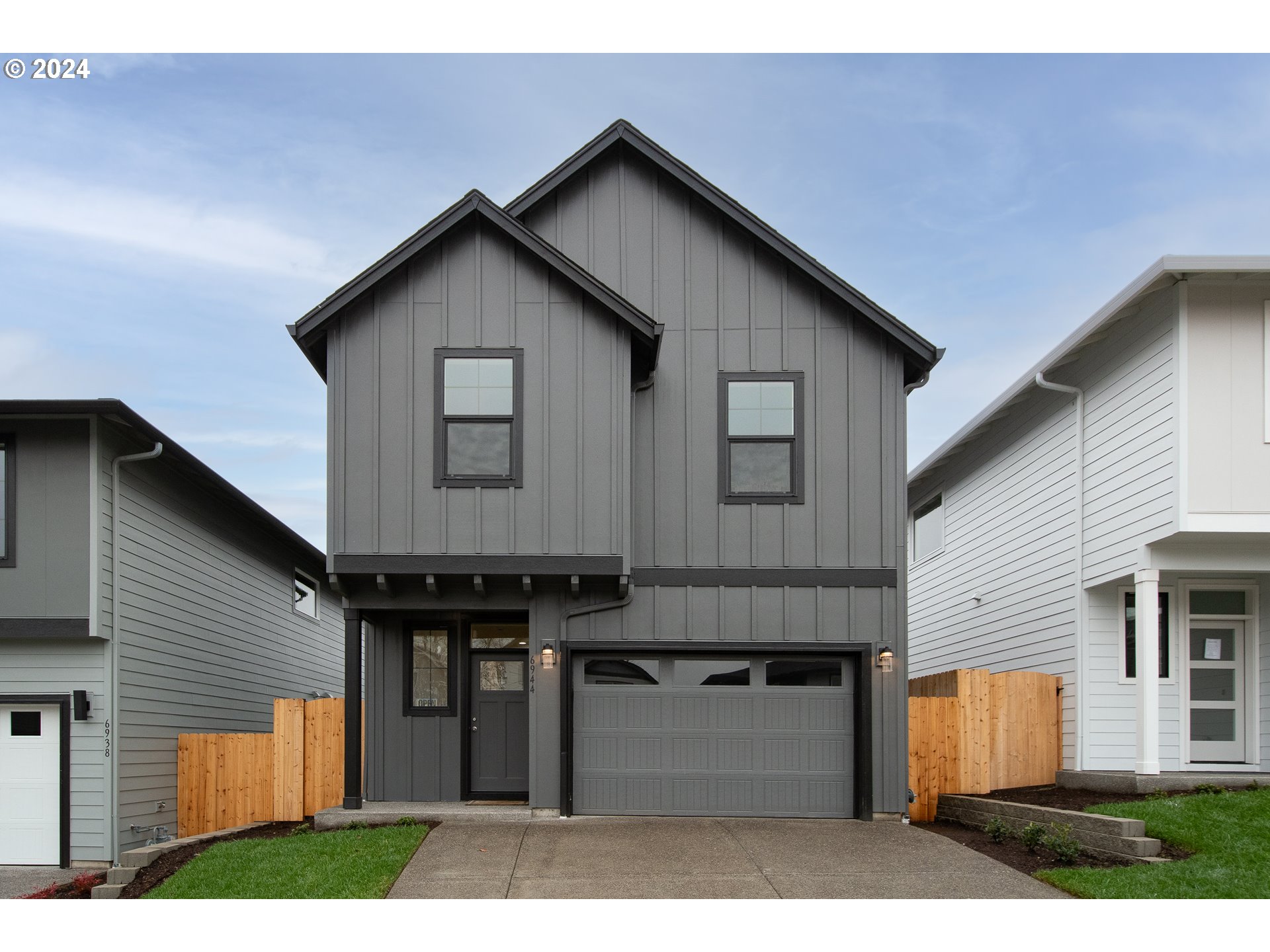 6944 North Madison Circle Ridgefield, WA 98642 - Photo 1 of 1 a front view of a house with a yard and garage