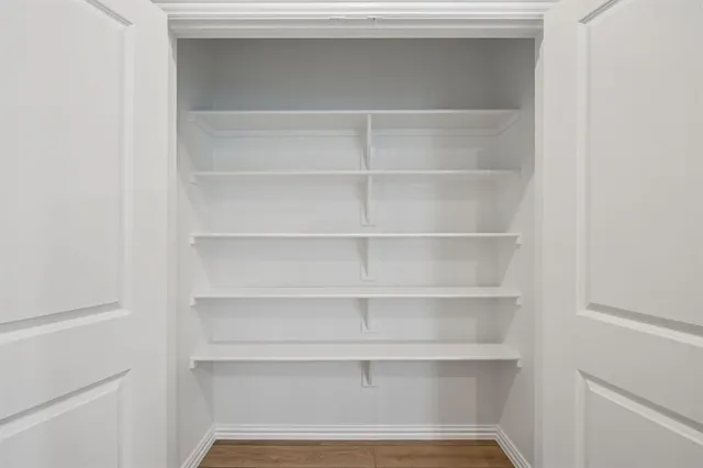 a stove top oven sitting inside of a kitchen