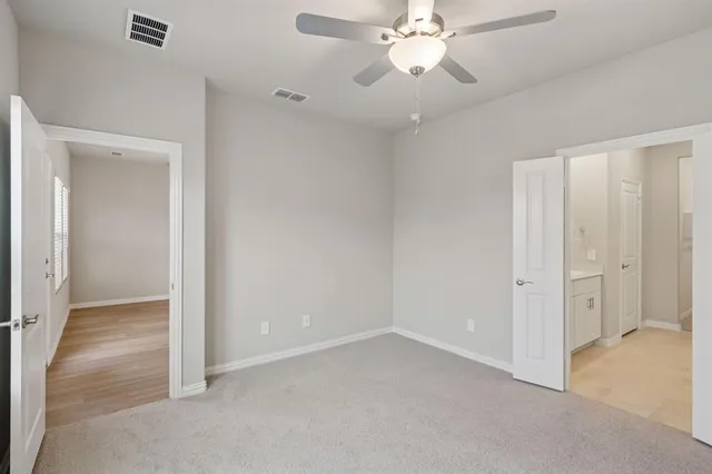 a bathroom with a double vanity sink a mirror and a shower