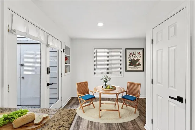 a dining room with furniture and window