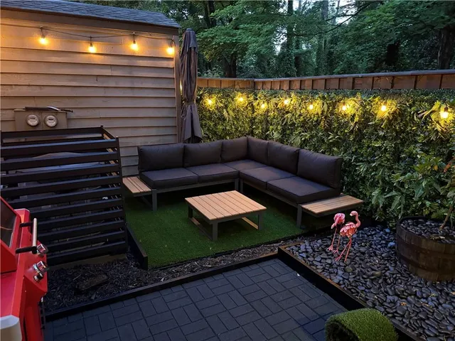 a view of a chairs and a table in the patio