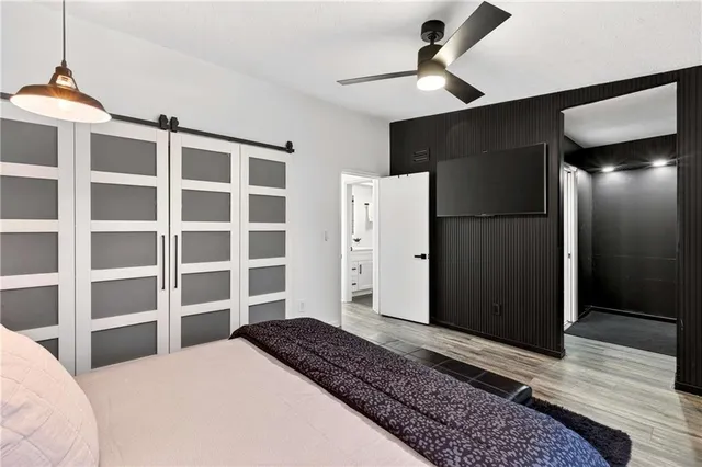 a bedroom with a bed and a walk in closet