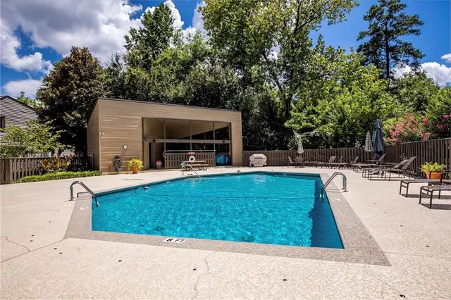 a view of a swimming pool with a patio